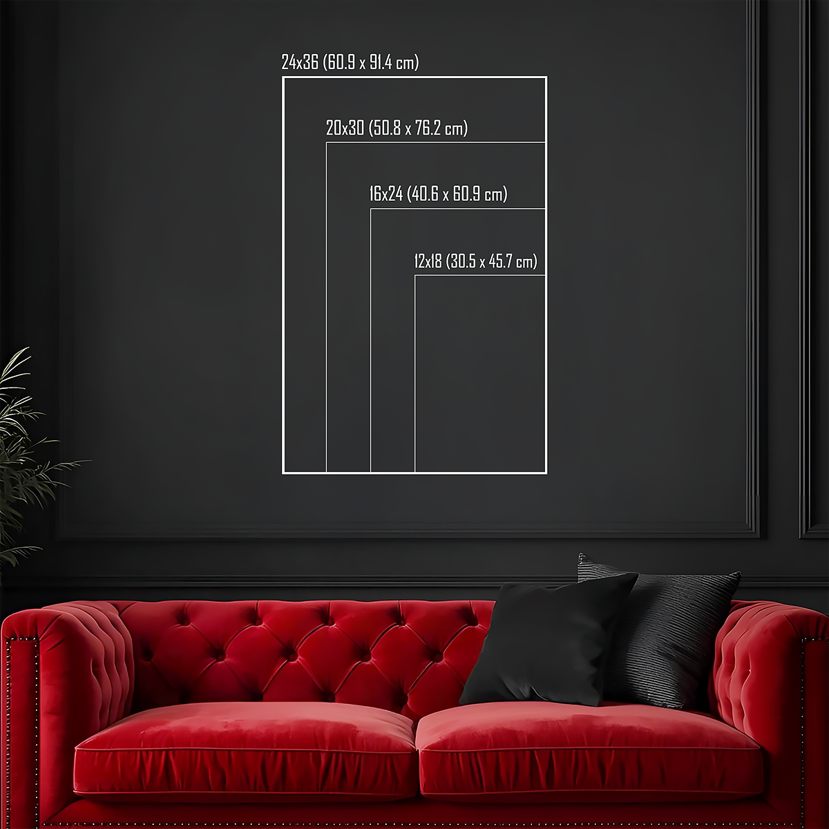 Red sofa with black cushions against a dark wall with framed measurements.