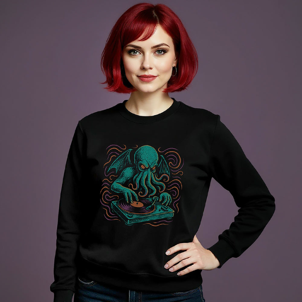 Woman wearing a black sweatshirt with a blue green octopus Cthulhu design on a purple background