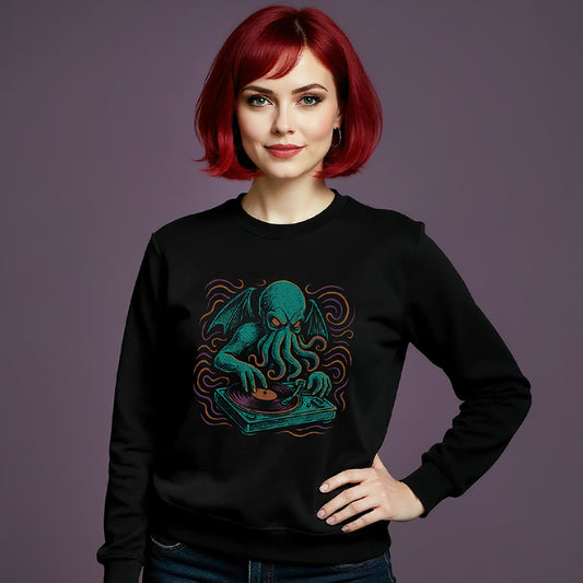 Woman wearing a black sweatshirt with a blue green octopus Cthulhu design on a purple background
