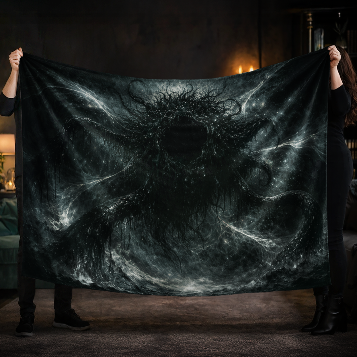 Two people holding up a dark art blanket with Azathoth digital painting design in a dimly lit room