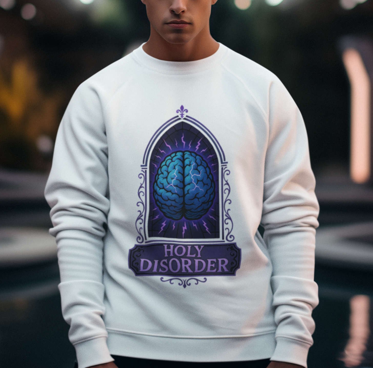 Person wearing a white sweatshirt with a brain design and 'Holy Disorder' text.