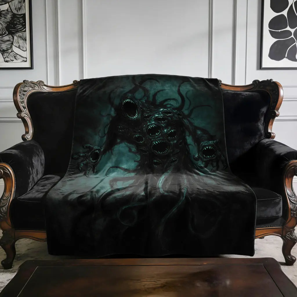 Nyarlathotep The Crawling Chaos - Lovecraft Inspired Velveteen Plush Blanket on an antique sofa