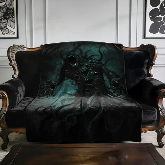Nyarlathotep The Crawling Chaos - Lovecraft Inspired Velveteen Plush Blanket on an antique sofa